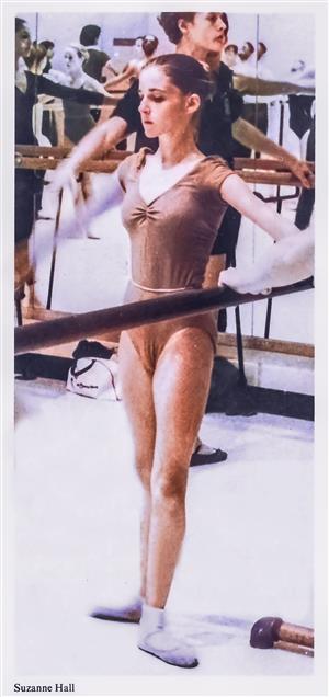 image of dancer Suzanna Galloney standing at the bar